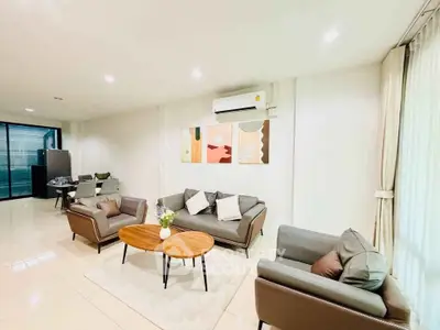 Spacious modern living room with stylish furniture and natural light