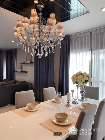 Elegant dining room with chandelier and modern decor