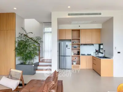 Modern open-layout kitchen with sleek appliances and stylish decor