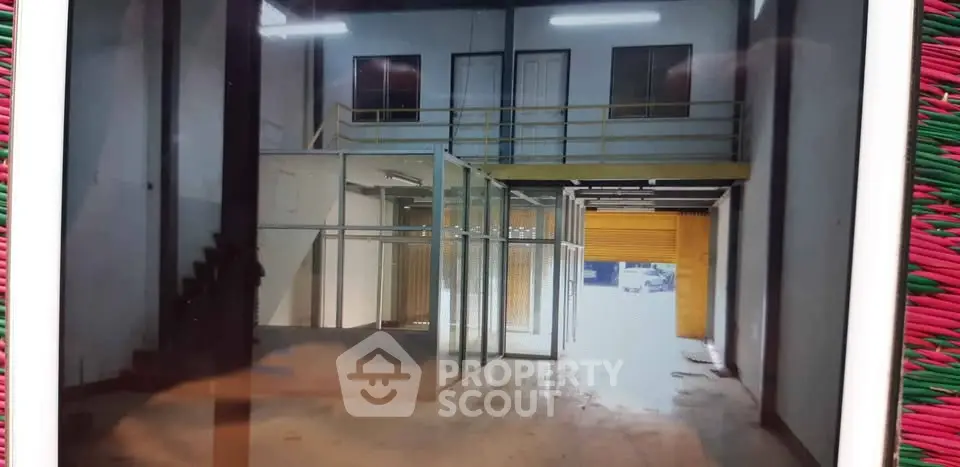 Spacious industrial warehouse with mezzanine and office space, ideal for business operations.