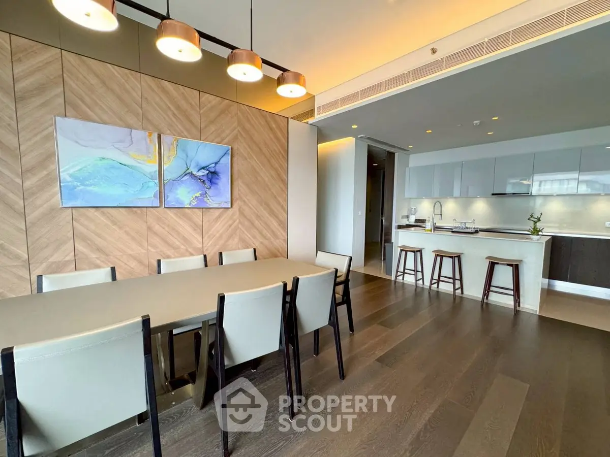Modern open-plan kitchen and dining area with stylish decor and ample natural light.