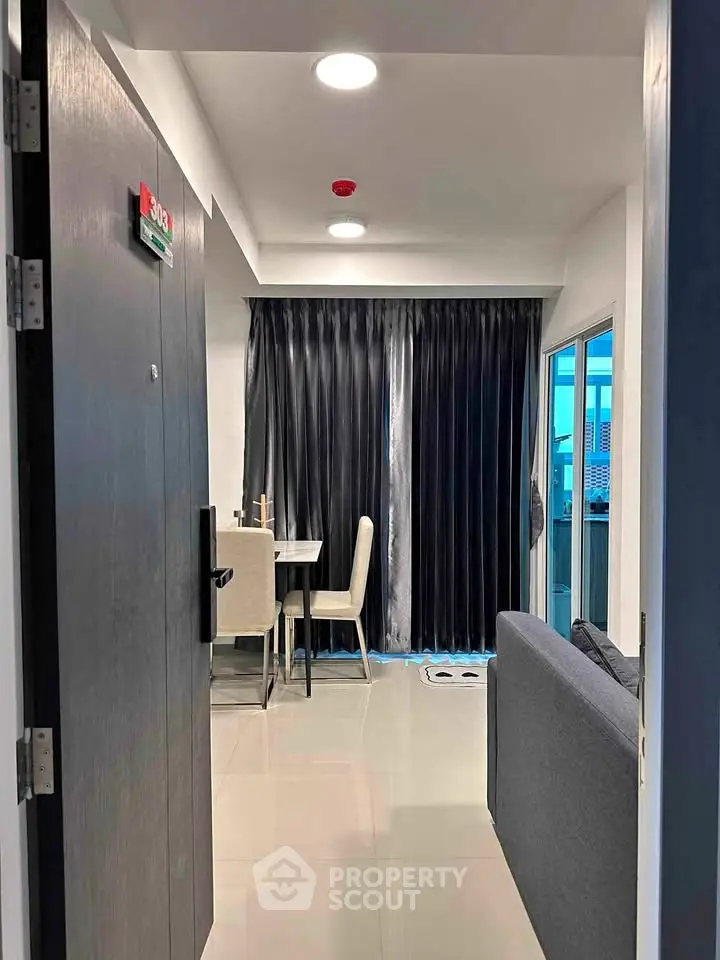 Modern apartment entrance with sleek interior and balcony view