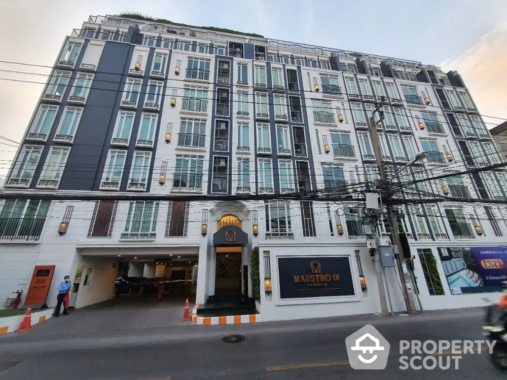 Elegant urban condominium exterior with modern design and multiple floors, ideal for city living.