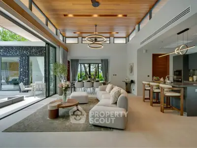 Luxurious open-plan living room with modern kitchen and elegant decor