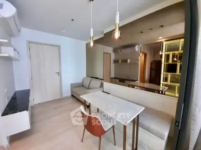 Modern living room with stylish furniture and elegant lighting in a contemporary apartment.