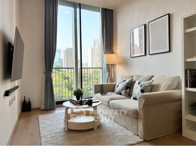 Modern living room with city view, cozy sofa, and stylish decor