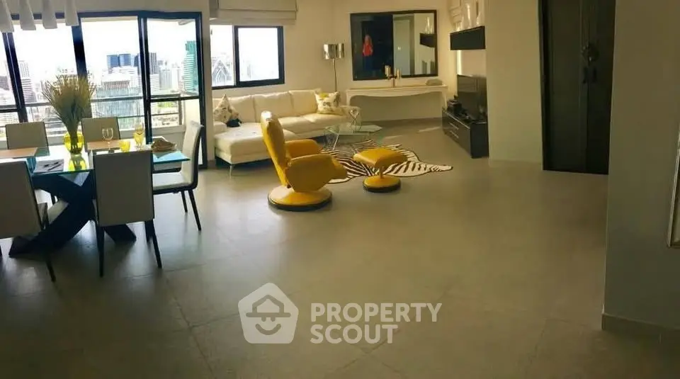 Spacious modern living room with city view, stylish furniture, and elegant dining area.