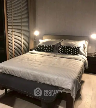 Cozy bedroom with modern decor and ambient lighting, perfect for relaxation.