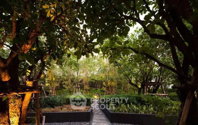 Lush garden with mature trees and landscaped pathways in a serene setting.
