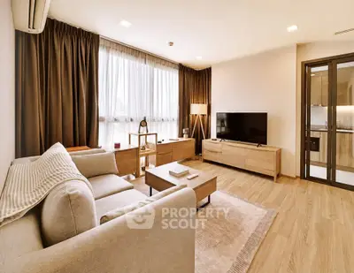Spacious modern living room with elegant decor and natural light
