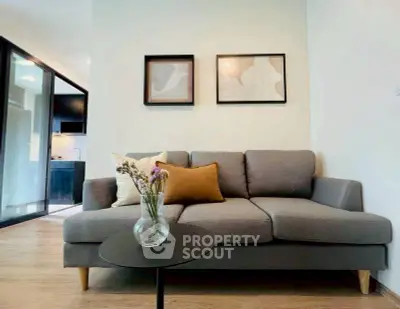 Modern living room with stylish gray sofa and elegant decor