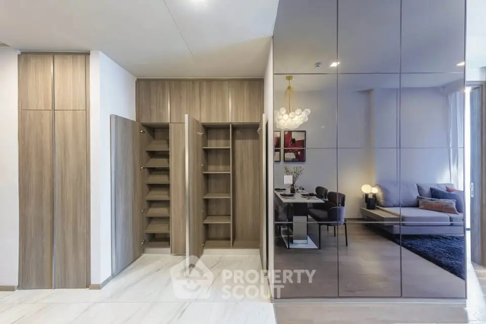 Modern open-plan living room with sleek storage and elegant dining area