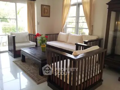 Charming living room with elegant wooden furniture and natural light