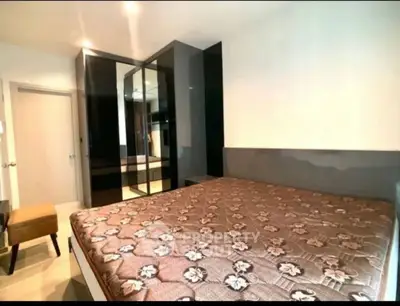 Modern bedroom with mirrored wardrobe and stylish decor