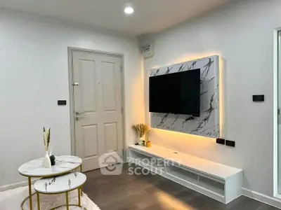 Modern living room with stylish TV setup and elegant marble tables