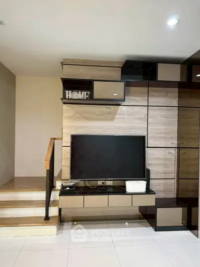 Modern living room with sleek TV unit and stylish shelving