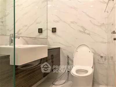 Modern bathroom with sleek design and marble walls