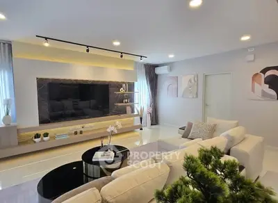 Luxurious modern living room with elegant decor and spacious seating area.