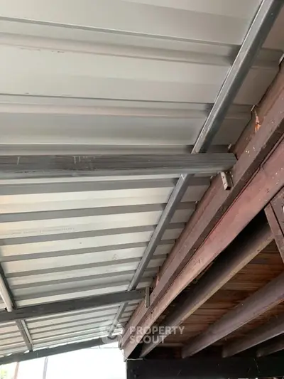 Industrial-style metal and wood ceiling structure in modern building