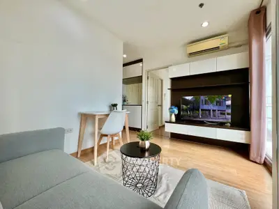 Modern living room with sleek furniture and natural light