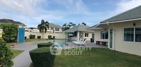 Luxurious villa with private pool and manicured garden in tropical setting