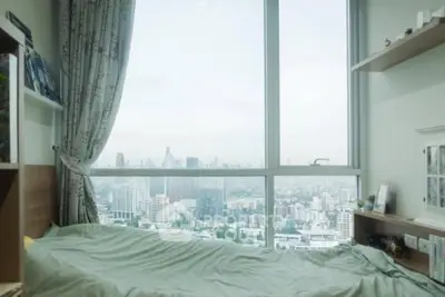Stunning bedroom with panoramic city view and modern decor