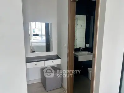 Modern apartment with sleek bathroom and vanity area
