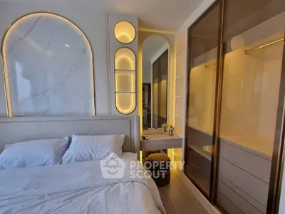 Luxurious bedroom with elegant lighting and spacious walk-in closet