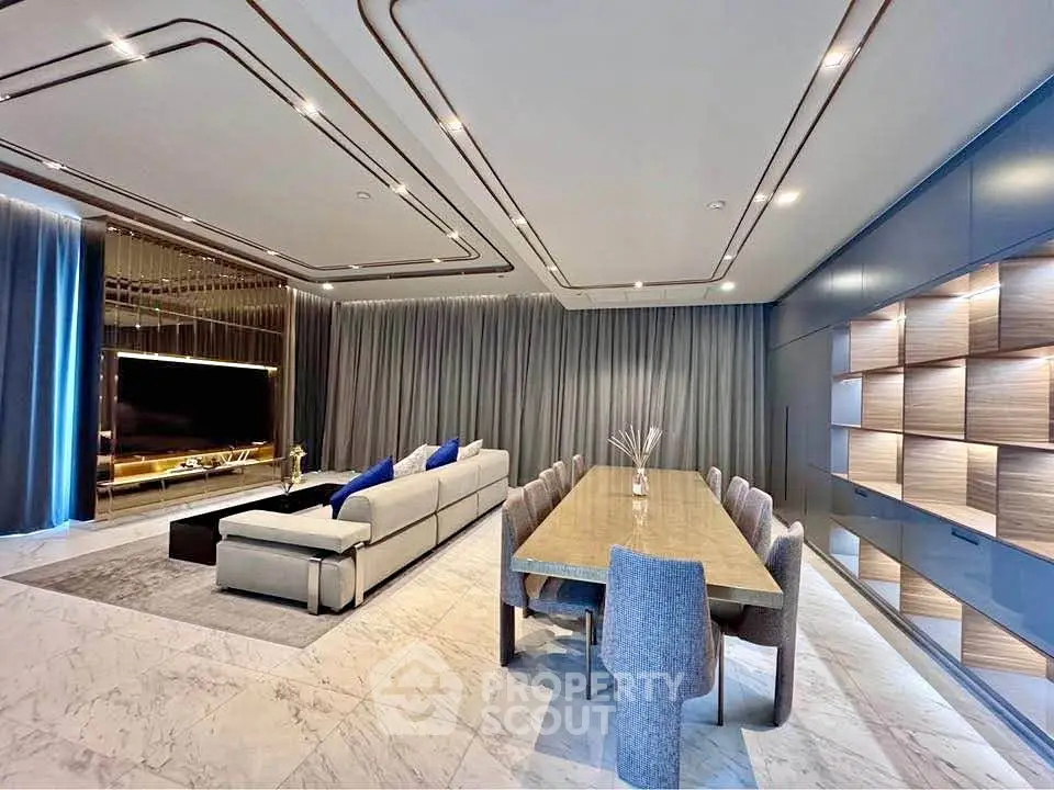 Luxurious modern living room with elegant dining area and stylish decor, perfect for upscale living.