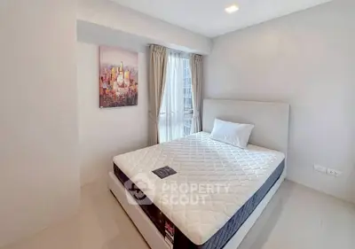 Modern minimalist bedroom with large window and cityscape artwork.