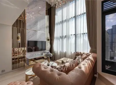 Luxurious living room with high ceilings, elegant chandelier, and stunning city view.