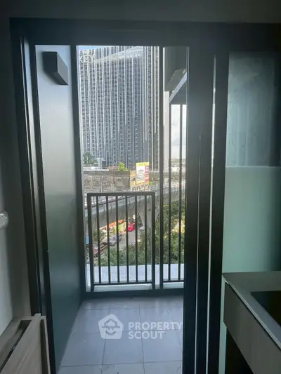 Modern apartment balcony with city view, perfect for urban living.