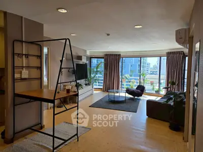 Spacious modern living room with large windows and stylish decor