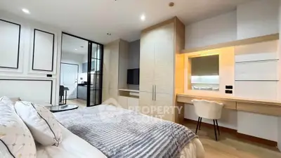 Luxurious modern bedroom with elegant decor and spacious layout, featuring a cozy bed and stylish furniture.