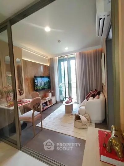 Modern living room with stylish decor and large windows offering natural light