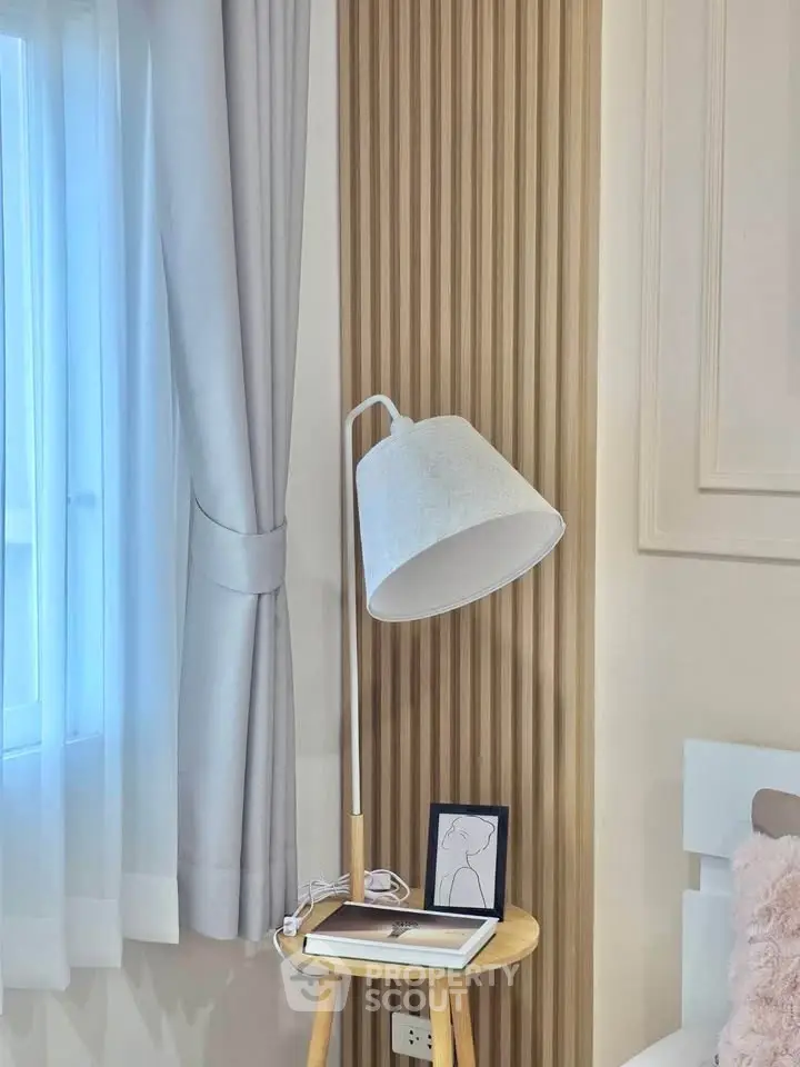 Stylish bedroom corner with modern lamp and elegant decor