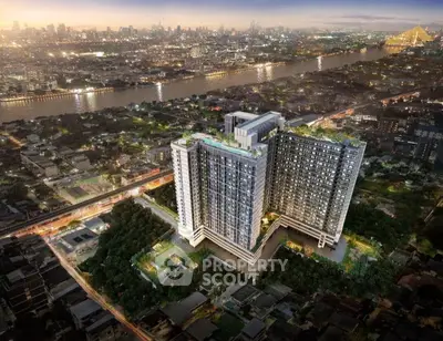 Stunning aerial view of modern high-rise building with cityscape and river backdrop.