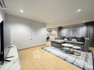 Spacious modern living room with stylish furniture and open layout