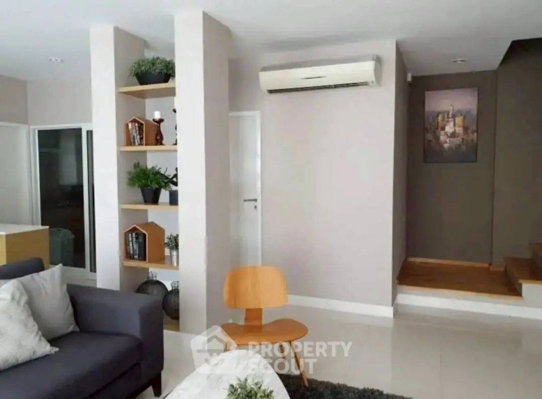 Modern living room with stylish decor and air conditioning
