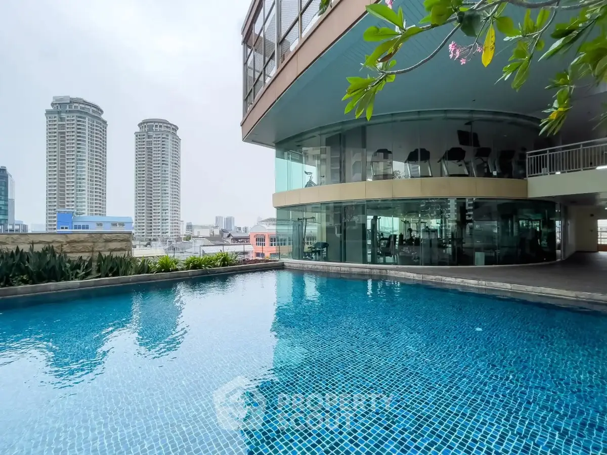 Luxurious high-rise building with stunning rooftop pool and city view