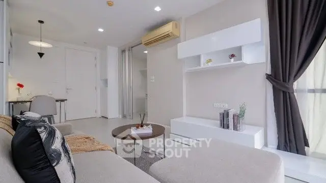 Modern living room with sleek furniture and natural light