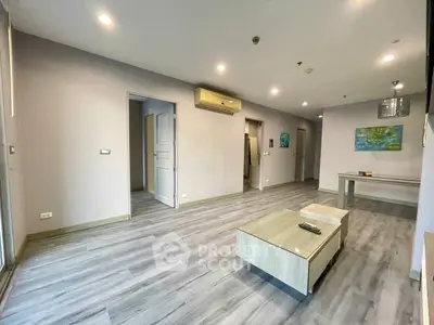 Spacious modern living room with sleek flooring and stylish furniture