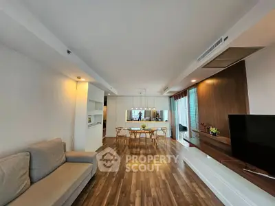 Spacious modern living room with wooden flooring and stylish decor