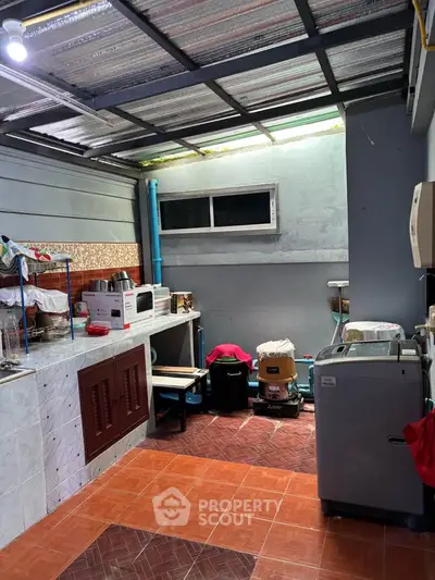 Spacious kitchen with modern appliances and open layout, perfect for culinary enthusiasts.