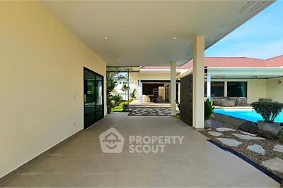 Spacious modern patio with pool view in luxury villa