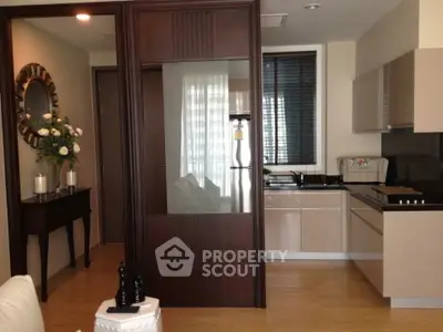 Modern kitchen with sleek cabinetry and open layout in stylish apartment