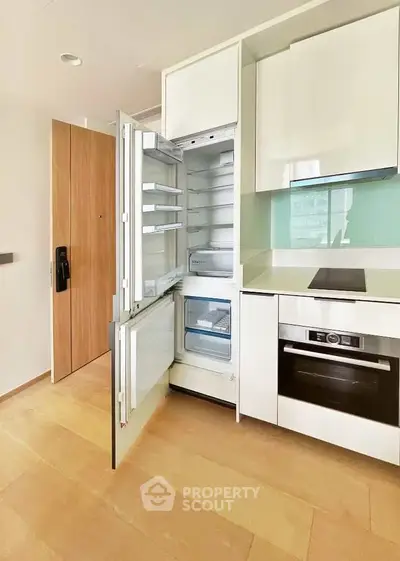 Modern kitchen with integrated appliances and sleek cabinetry