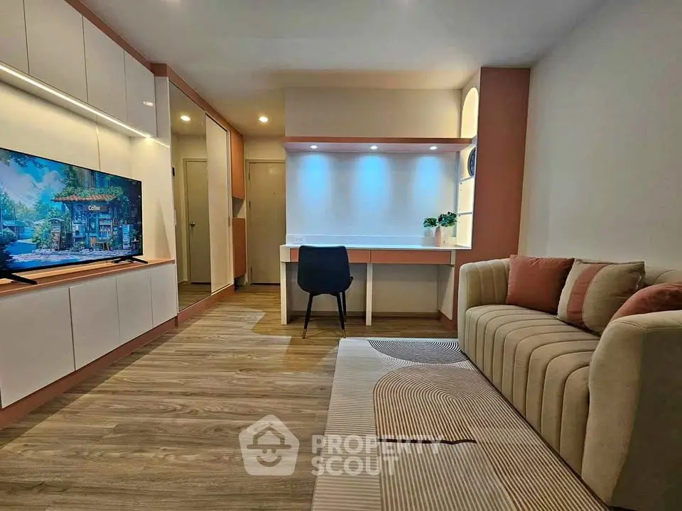 Modern living room with stylish decor, built-in storage, and cozy seating area, perfect for relaxation and entertainment.