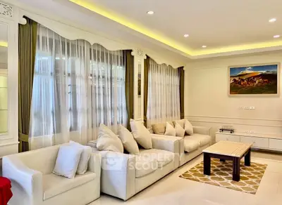 Elegant living room with plush sofas and stylish decor, perfect for relaxation and entertaining.