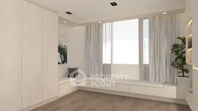 Spacious modern living room with large windows and minimalist decor